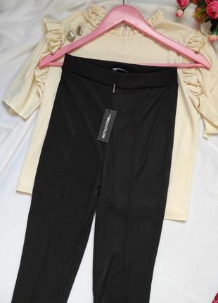 Чорные лосины штаны по фигуре снизу кльош с разрезом брюки женские в обтяжку4 фото