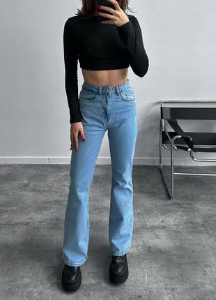Жіночі джинси клеш від коліна7 фото