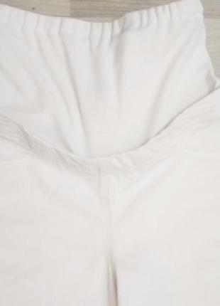 Рваные белые джинсы лосины для беременных.2 фото
