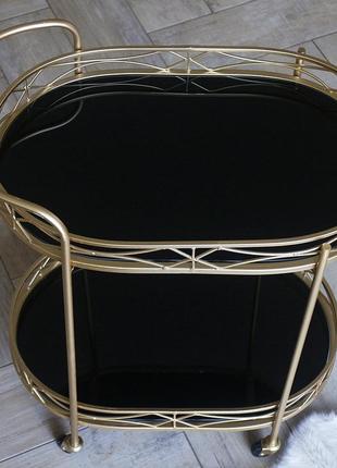 Сервірувальний золотий столик на колесах з металу з чорною скл...5 фото