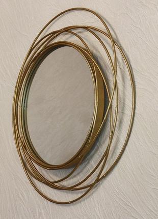 Настінне дзеркало кругле зі скла та металу із золотою рамою гр...6 фото