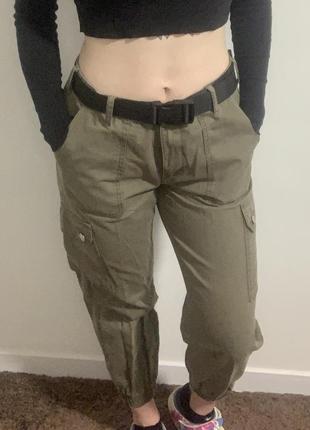 Army-green cargo pants with belt