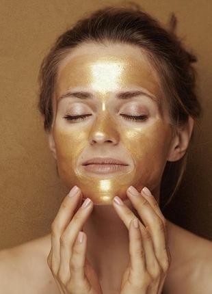 Spa маска - пленка для лица с эффектом мерцания и ароматом дерева уд " сияние золота "avon 50 ml.2 фото
