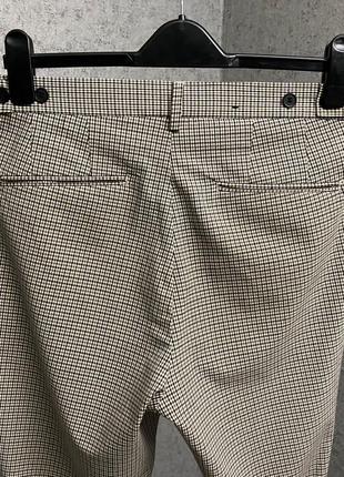 Бежевые клетчатые брюки от бренда h&m4 фото