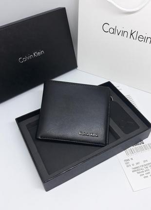 Чоловічий шкіряний гаманець портмоне з брелоком чорний1 фото