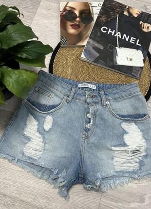 Джинсові шорти з потертостями