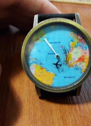 Наручний годинник з картою світу і літаючим літаком 4см міцний...3 фото