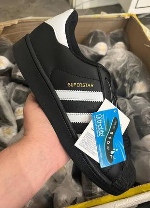 Adidas superstar black white gold logo