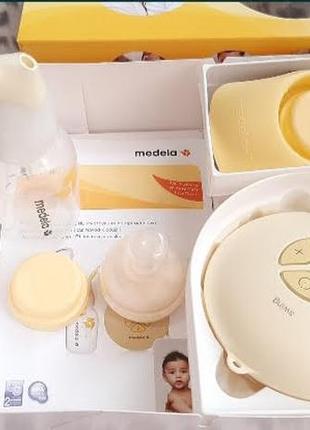 Электрический молокоотсос medela