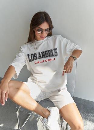 Трендовый костюм футболка оверсайз с надписью лос анджелес калифорния принтом шорты с высокой посадкой на резинке2 фото
