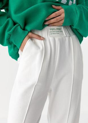 Жіночі трикотажні штани двонитка на манжетах — молочний колір,...4 фото