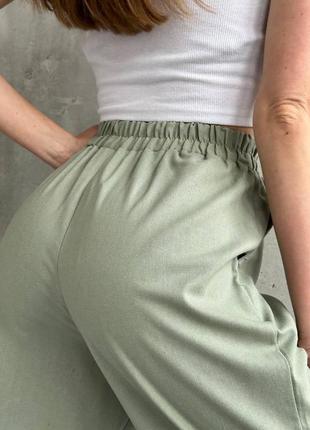 Жіночі літні лляні брюки у розмірах s-l широкі прямі вільного крою з резинкоюна талії вісока посадка5 фото