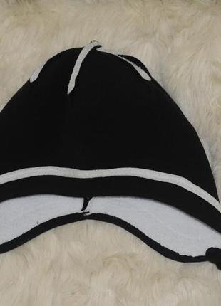 Шапка с ушками с кисточками флисовая черно-белая для ребенка