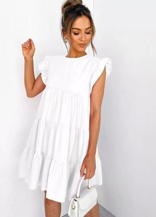 Біле плаття-волан