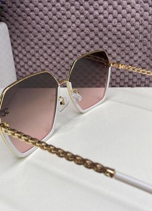 Модні жіночі брендові сонцезахисні окуляри в металевій оправі ...8 фото