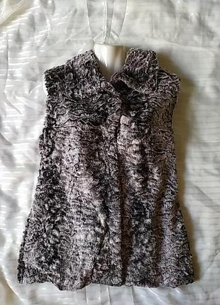 Жилет - безрукавка .