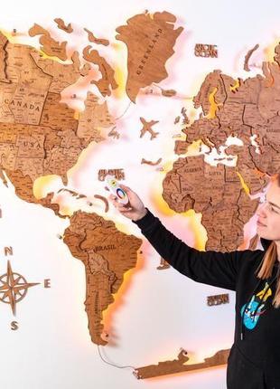 Деревянная карта мира на стену 100х60 см светлая с подсветкой1 фото