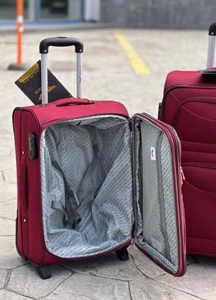 Середня валіза дорожня тканинна m польща на колесах wings з підшипником7 фото