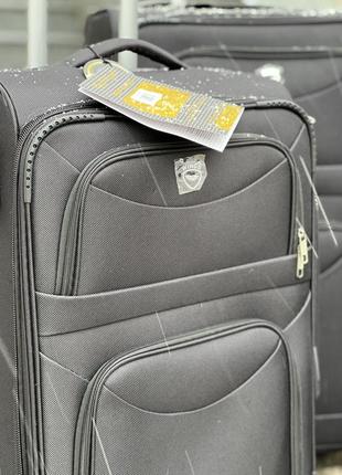 Середня валіза дорожня тканинна m польща на колесах wings з підшипником4 фото