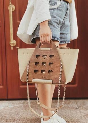 Жіноча стильна сумочка з елементами дерева figlimon l| бежева з сердечком1 фото