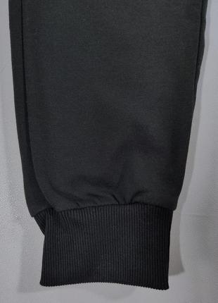 Спортивные штаны черные с манжетом для мужчин l(48)7 фото