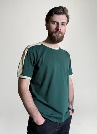 Зеленая футболка украинского производителя. легкая, прочная и мягкая