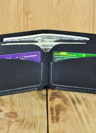 Кожаный кошелек вмещает в себя купюры и кредитные карты5 фото