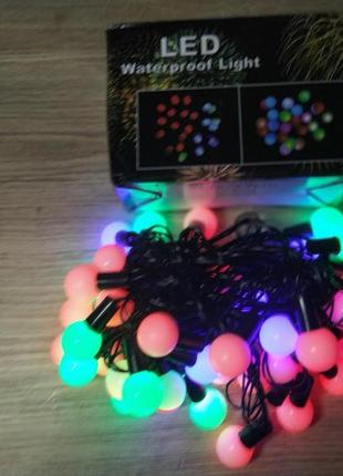 Новорічна різнокольорова led-гірлянда матові кульки 4 м3 фото