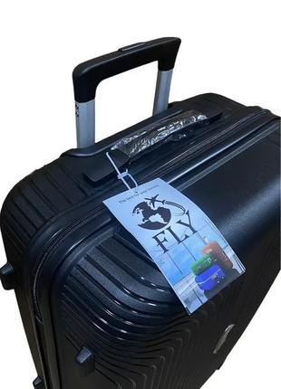 Середній полипропиленовый дорожній валізу на 4-х колесах"fly" м5 фото