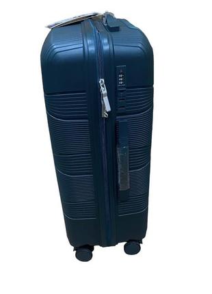 Середній полипропиленовый дорожній валізу на 4-х колесах"fly" м3 фото