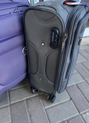 Дорожня валіза ручна поклажа на 4 колесах фіолетова4 фото