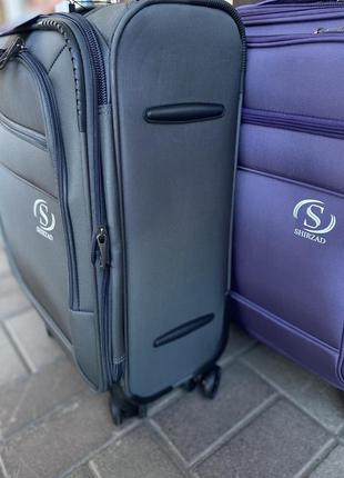 Дорожня валіза ручна поклажа на 4 колесах фіолетова5 фото