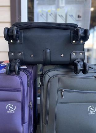 Дорожня валіза ручна поклажа на 4 колесах фіолетова9 фото