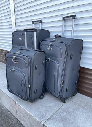 Набір тканинних валіз fly 8303-4 на 4 колесах 3 штуки сірий3 фото