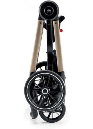 Универсальная коляска 2 в 1 cam techno milano на золотистой раме черная с цветочным принтом3 фото