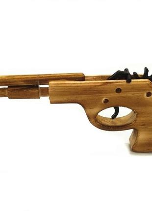Дерев'яний пістолет, що стріляє гумками8 фото