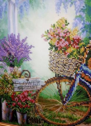 Картина бісером виставка квітів, прованс, велосипед, альтанка3 фото