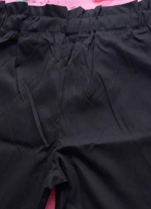 Чорні штани з кишеньками3 фото