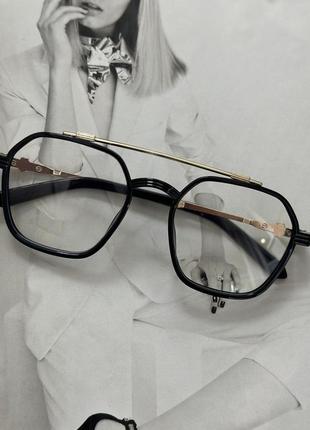Іміджеві окуляри унісекс в чорній оправі з золотом  (1233)1 фото