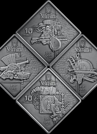 Набір з чотирьох срібних пам`ятних монет "козацькі клейноди" у футлярі з флоковим покривом