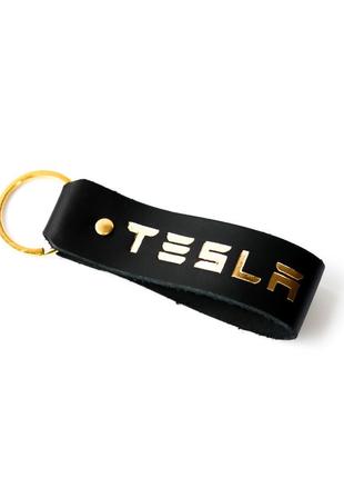 Брелок-петля з написом "tesla" чорний з позолотою.