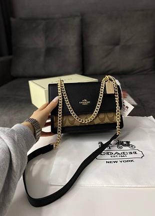 Сумка кросс боди premium coach mini klare crossbody in signature canvas in light khaki/snake