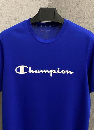 Синя футболка від бренда champion3 фото