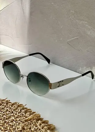 Жіночі овальні сонцезахисні окуляри в металевій оправі з полярізацією8 фото
