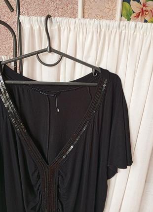 Красива чорна блуза оздоблена паєтками essence.4 фото