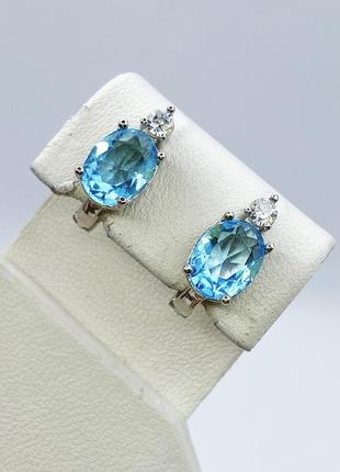 Сережки серебряные с голубым топазом и кубическим цирконием 3,55 г