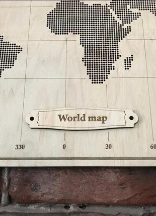 Карта мира из фанеры, перфорированная, декорированная компасом 66,5*47 см4 фото