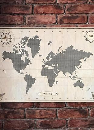 Карта мира из фанеры, перфорированная, декорированная компасом 66,5*47 см