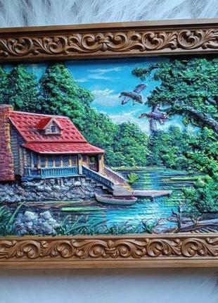 Картина будиночка біля озера
