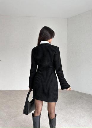 Трикотажное мини платье длинные расклешенные рукава черный3 фото
